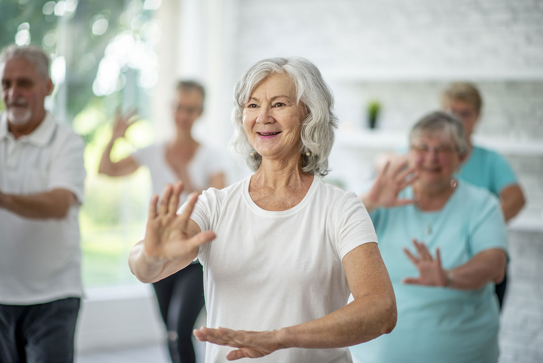 Senior citizens exercise together